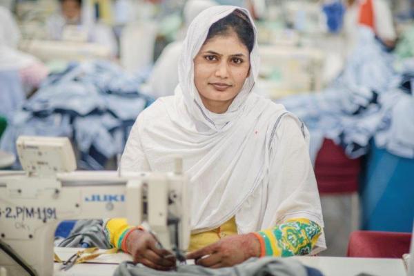 In Bangladesh, Parul receives her salary from the textile factory where she works via mobile money.